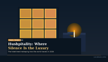 A featured promotional banner titled Hushpitality: Where Silence Is the Luxury under a TRAVEL TRENDS 2026 category tag on Lexica Routes, subtitled The hotel trend reshaping how the world travels in 2026. The minimalist vector design features a golden glowing nine-pane window beside a lit match casting a warm circular light against a dark blue background.